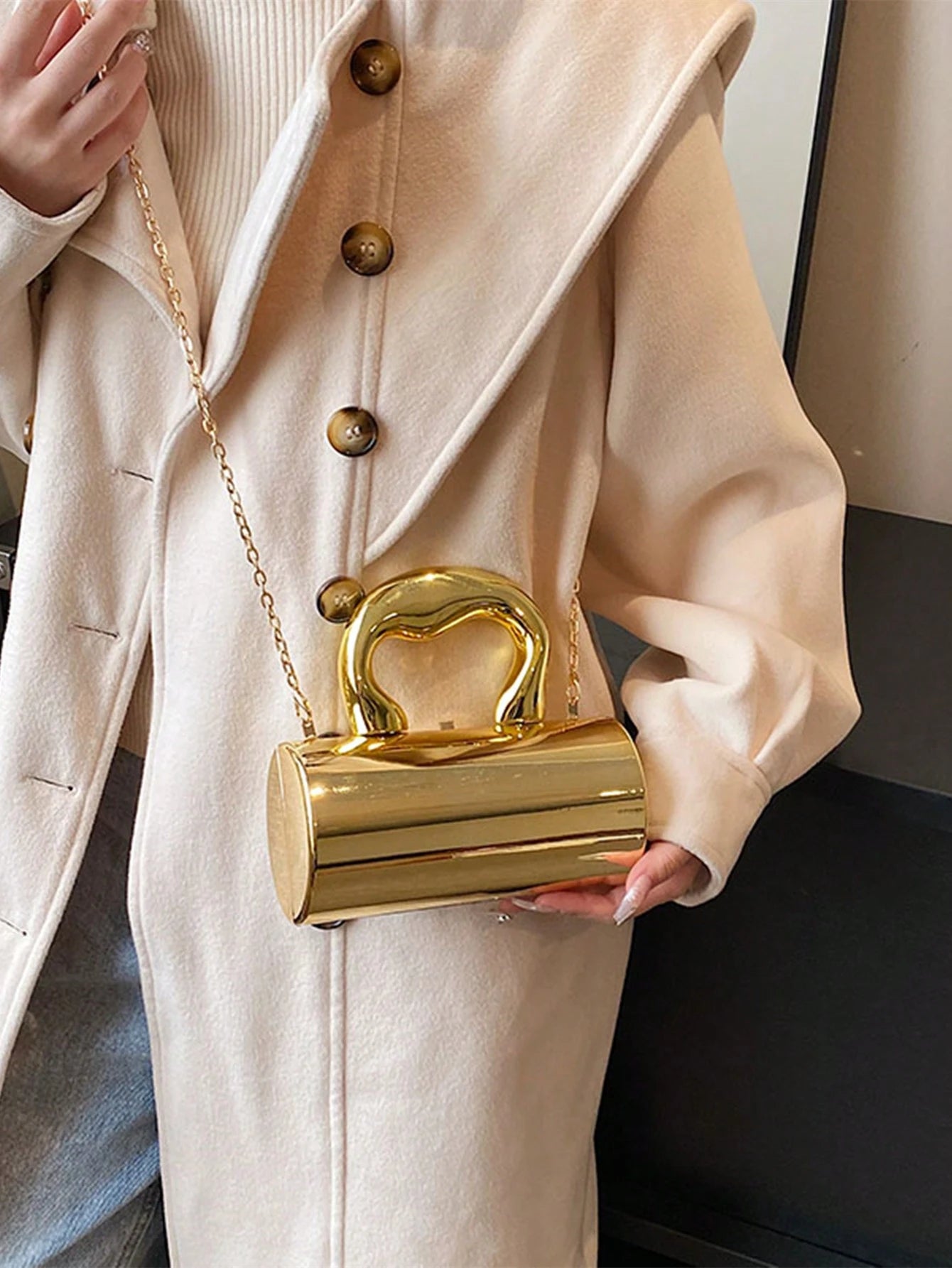Auric Curve Mini Clutch – Sculptural Gold Statement Bag