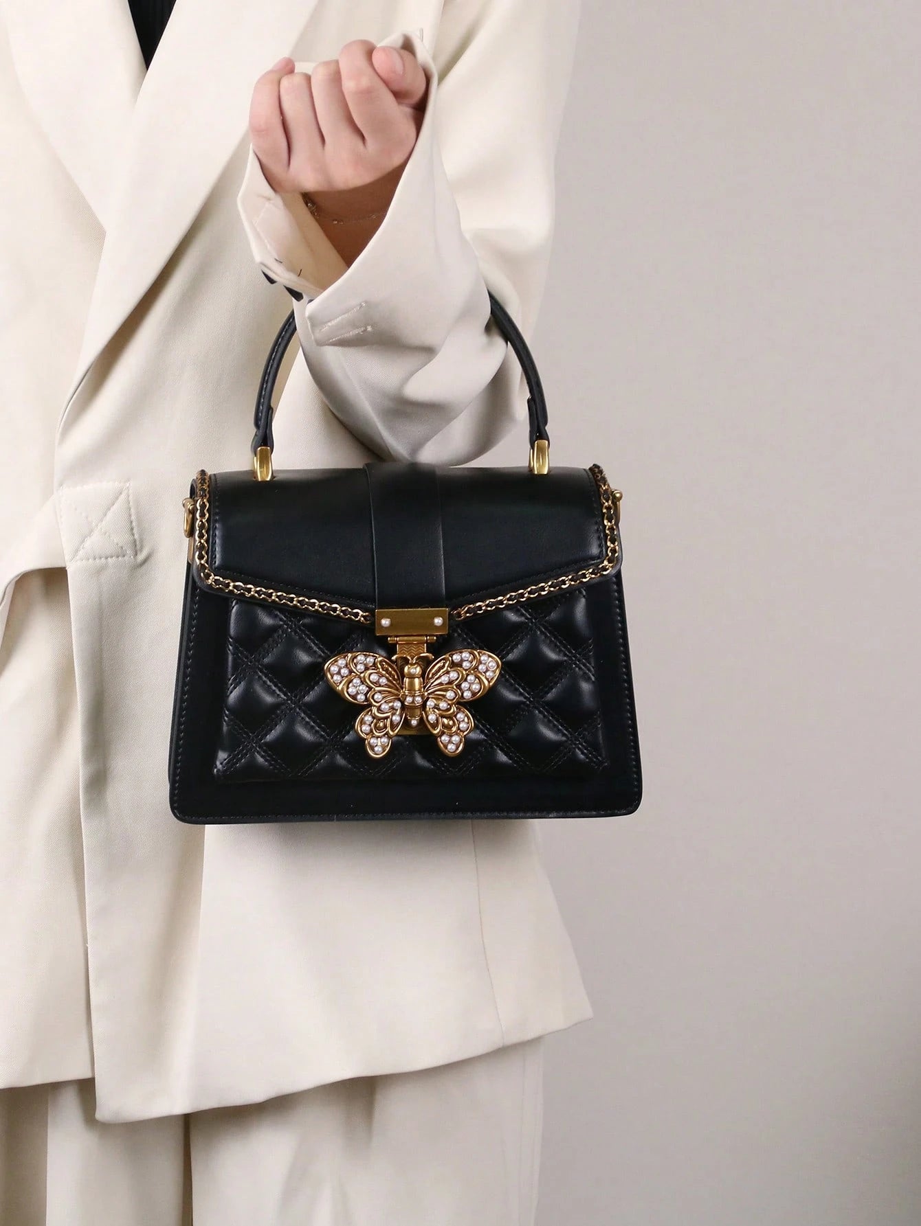 Butterfly Lock Quilted Top-Handle Bag