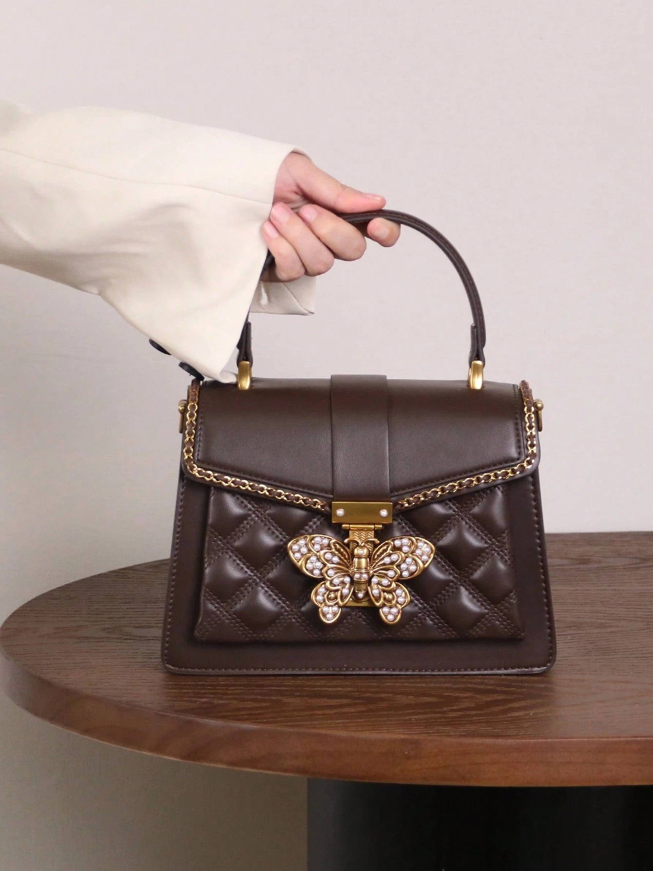 Butterfly Lock Quilted Top-Handle Bag